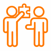 Zwei Personen mit Puzzleteil als Coaching-Symbol